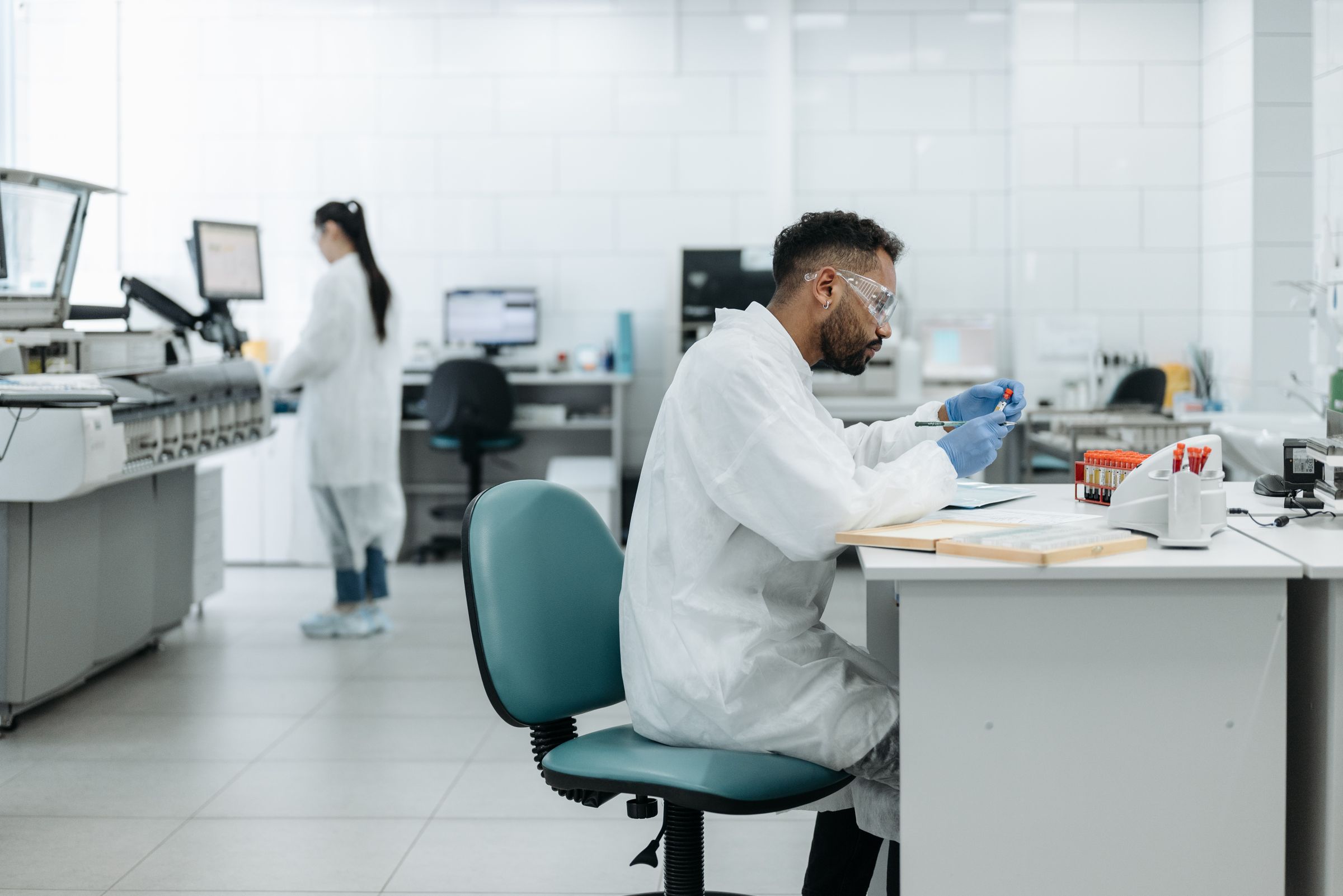 A scientist working at a lab desk