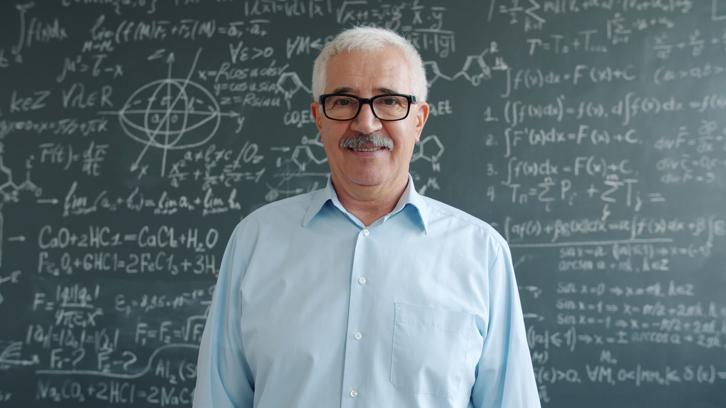 A professor at a chalkboard