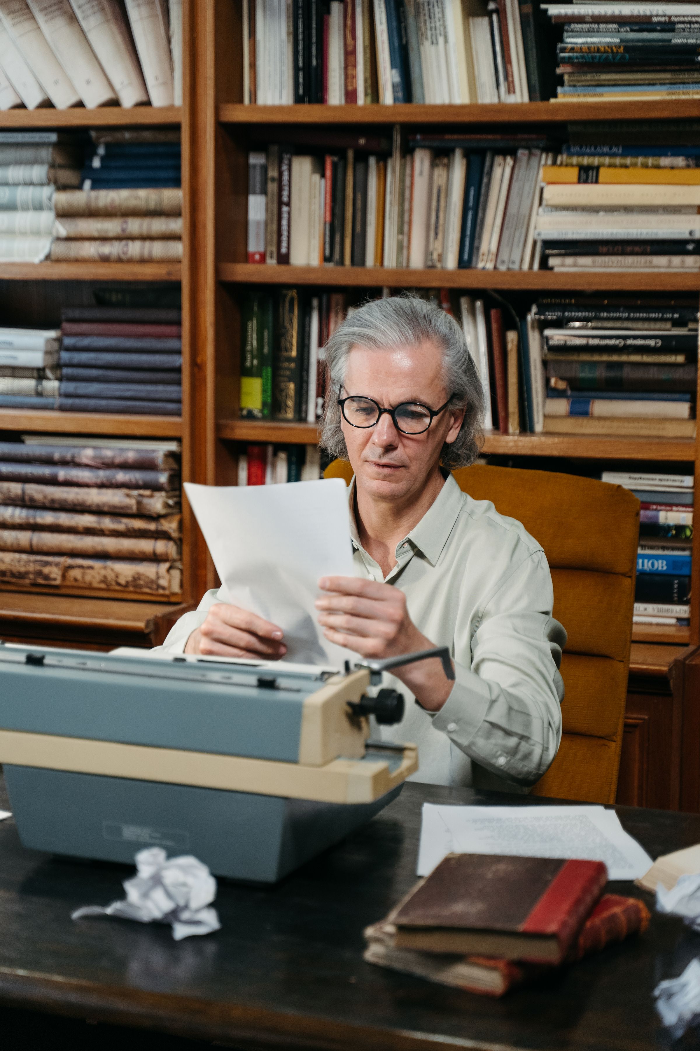 A senior researcher reviewing documents