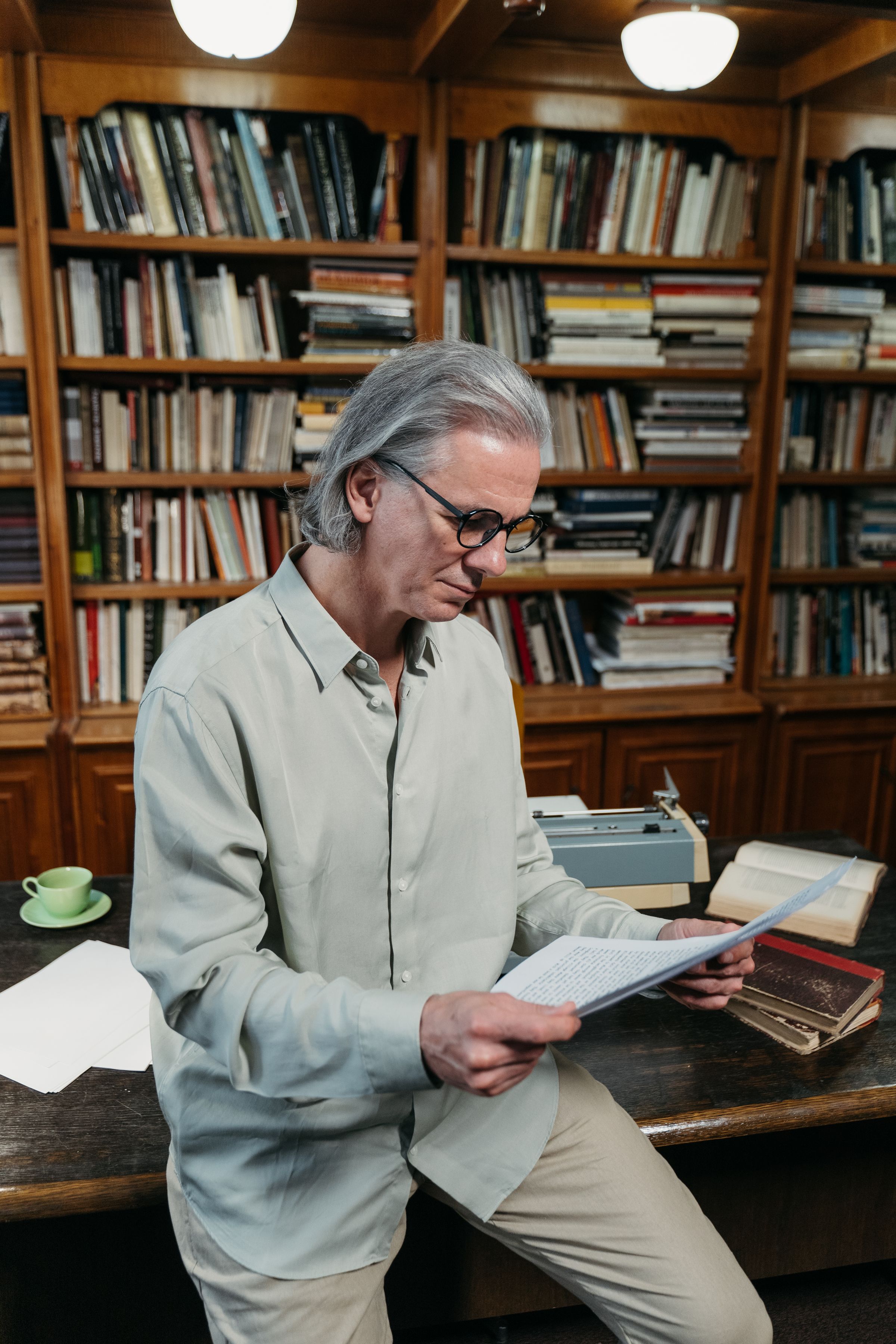 A senior researcher reading a paper