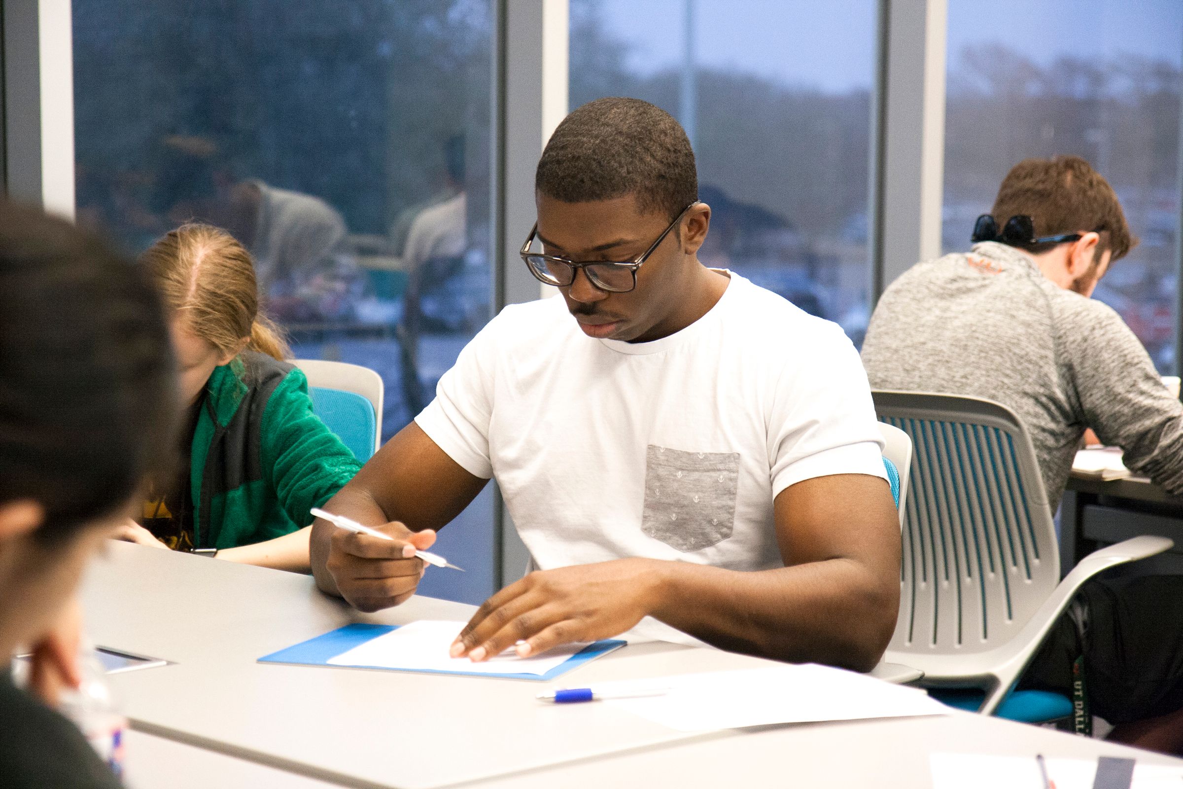 A student studying in a classroom